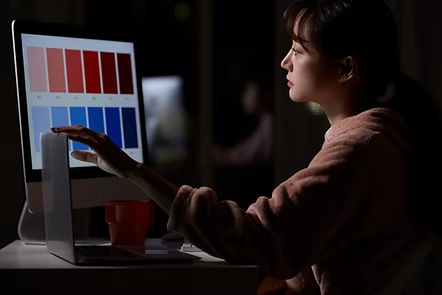 Designer selecting colours on screen for customer-specific stock