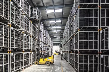 Warehouse with large stock containers illustrating bulk stock movements